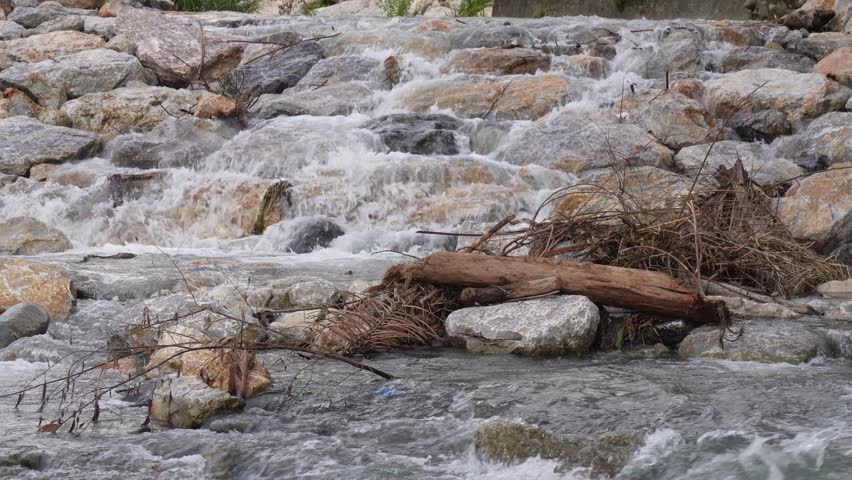 Refreshing Mountain Stream Water Rushing Through Rocky Riverbed