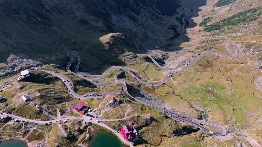 Winding Transfagarasan road in mountains, aerial view, travel excitement