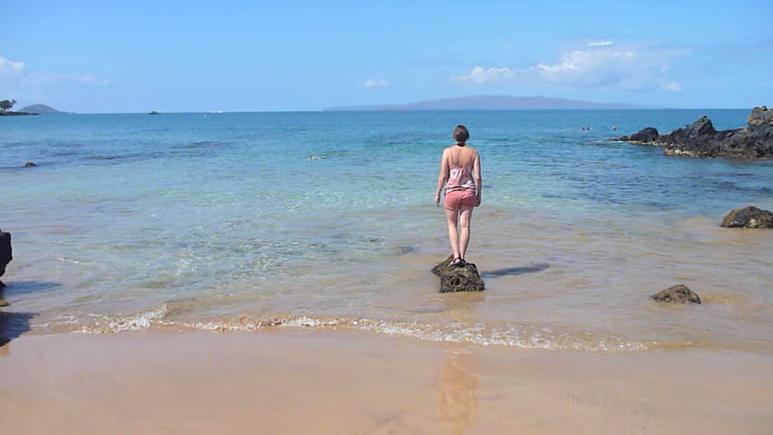 Model released woman enjoying ocean in Hawaii on Maui.