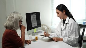 Kind female physician listens to a senior woman's health concerns, writing notes on a clipboard and prescribing medication during a medical examination in a modern hospital clinic room - Powered by Shutterstock - Get 15% off with code: PIKWIZARD15