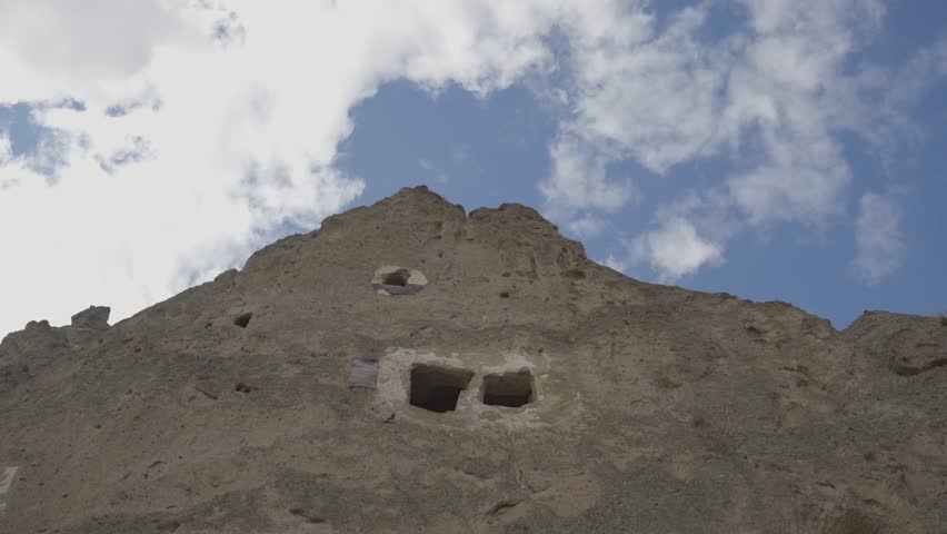 Ancient rock-cut cave dwellings carved into volcanic rock in Soganli Valley, Kayseri, Cappadocia, Turkey
