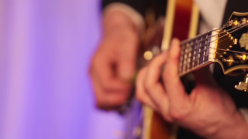 Cropped Man Playing Electric Guitar On A Live Band. Close-up Shot