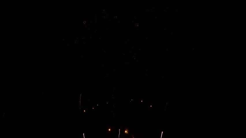 Amazing beautiful colorful firework display over sea on celebration night. Fireworks show for happy new year, 4k footage.