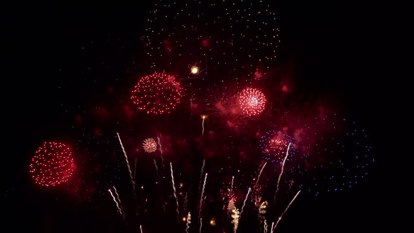Amazing beautiful colorful firework display over sea on celebration night. Fireworks show for happy new year, 4k footage.