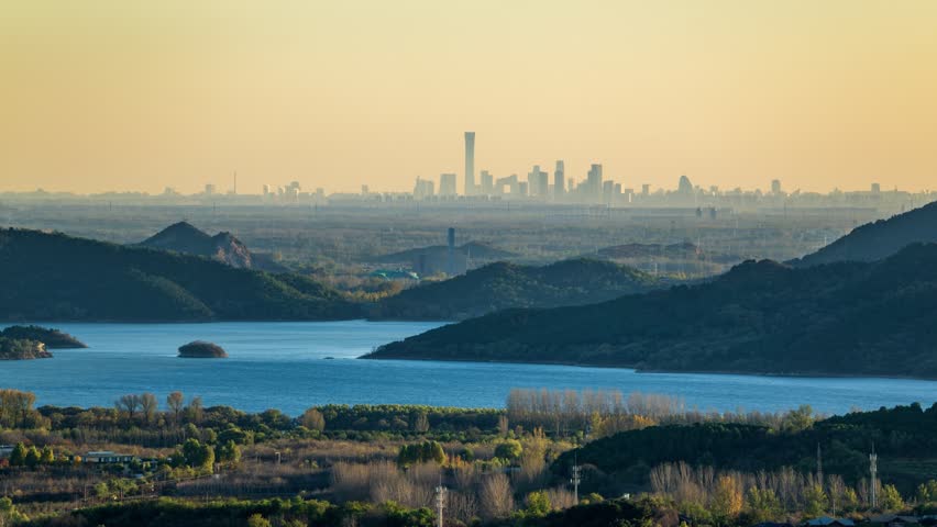 Beijing, China - 1st November 2025 - Overlooking Beijing cityscape over Huairou reservoir and mountains