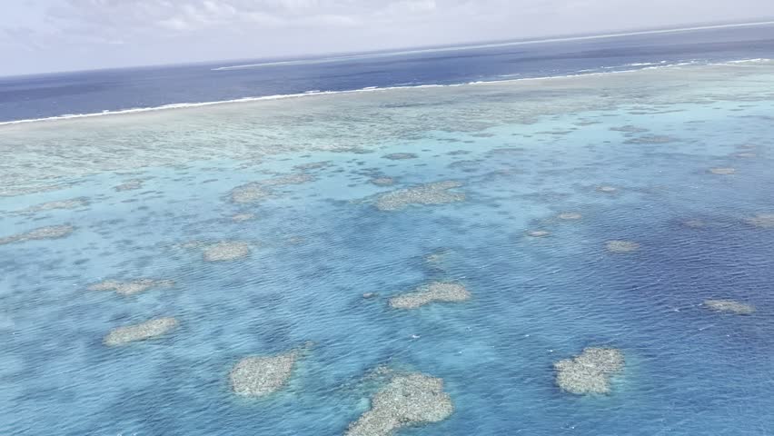 Aerial View of Great Barrier Reef Through Helicopter Window in Australia