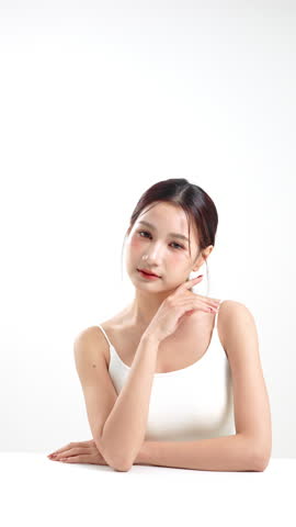 Beauty portrait of Asian woman with natural glowing skin for cosmetic self care wellness concept.