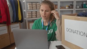 Woman with a laptop working in charity efforts appears as a blonde young volunteer organizing donation boxes in a shelter indoor. - Powered by Shutterstock - Get 15% off with code: PIKWIZARD15