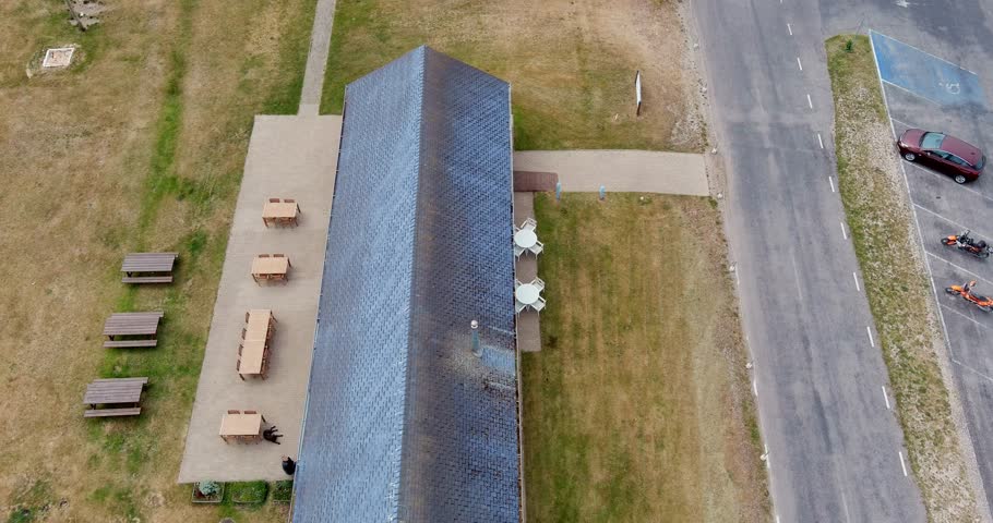 Aerial view of Sõrve Lighthouse, located at the southern tip of the Sõrve Peninsula in cloudy spring weather, Saaremaa, Estonia.