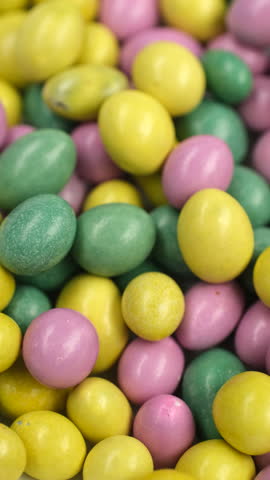 Multicolored candies close up, rotation. Assorted colorful chocolate candies