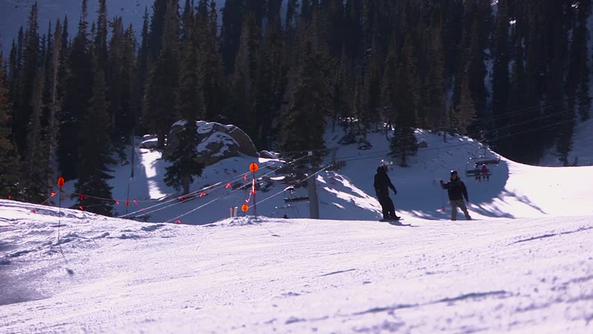 Snowboarder shredding down the mountain