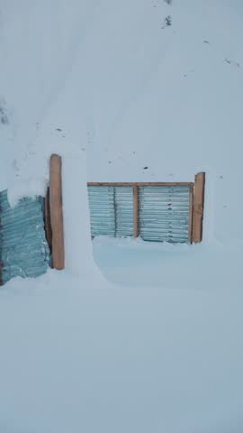 Open Metal sheet Gate Surrounded by Deep Snow, Rural Winter Entrance, Farm Life