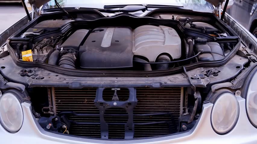 Close-up of the engine bay of a Mercedes-Benz E-Class car in Chisinau, Moldova, showcasing automotive engineering and design.