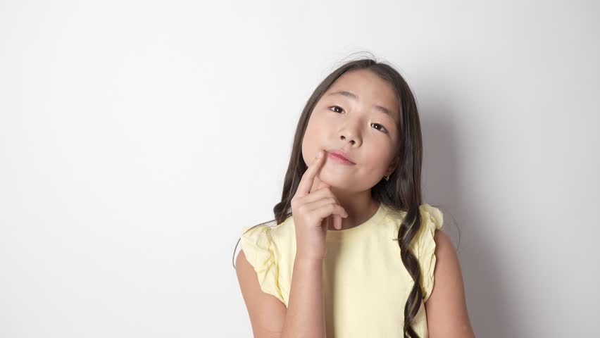 Thoughtful youn.g girl touching chin and thinking on white background.