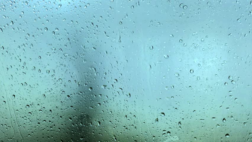 8K Realtime Raindrops Texture on Window Glass. High resolution close up of heavy rain dripping with natural audio included. Sharp detail ambient background