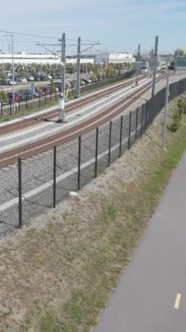 Train station that connects to public transport in a large car park.