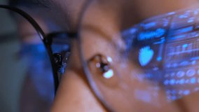 A person wearing glasses uses a laptop, with a real-time digital medical interface reflected in the lenses, representing healthcare analytics, clinical monitoring, and advanced medical technology.
 - Powered by Shutterstock - Get 15% off with code: PIKWIZARD15