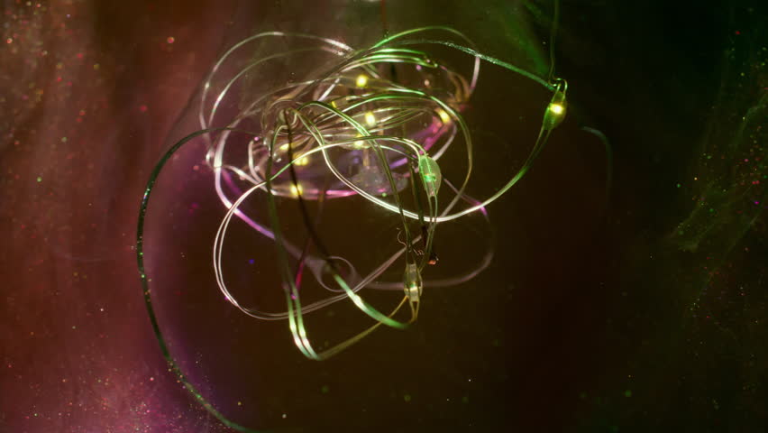 Vapor mix defocused. Art light wire. Colorful smoke spill on glass glow garland. Purple green fume paint swirl on glitter abstract black background.