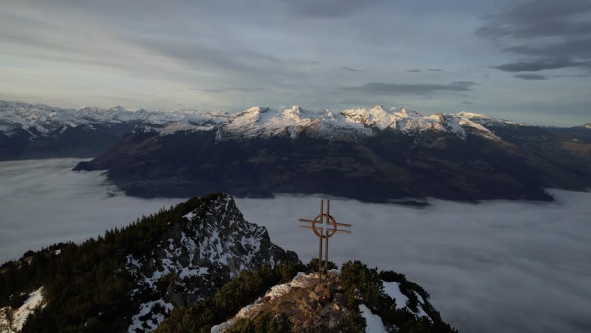 Beatiful morning hour in the swiss mountains with stuinng view on the cross of the mountain Alpspitz.