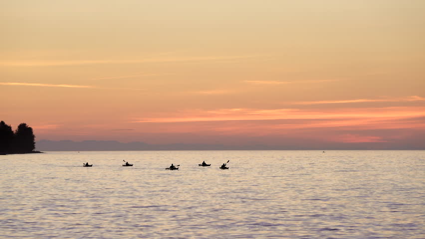 English Bay Sunset Paddlers Vancouver 4K UHD.Paddlers at sunset on English Bay. Vancouver, British Columbia, Canada. 4K, UHD.
