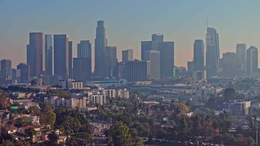 Sunset aerial flight above downtown with coastline Los Angeles skyline 
