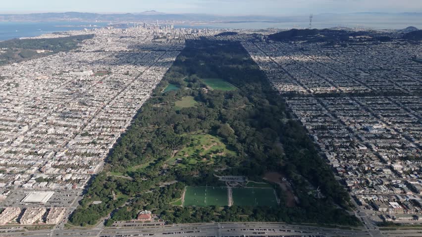 Aerial View Flying Forward Over Golden Gate Park Towards San Francisco Downtown Skyline
