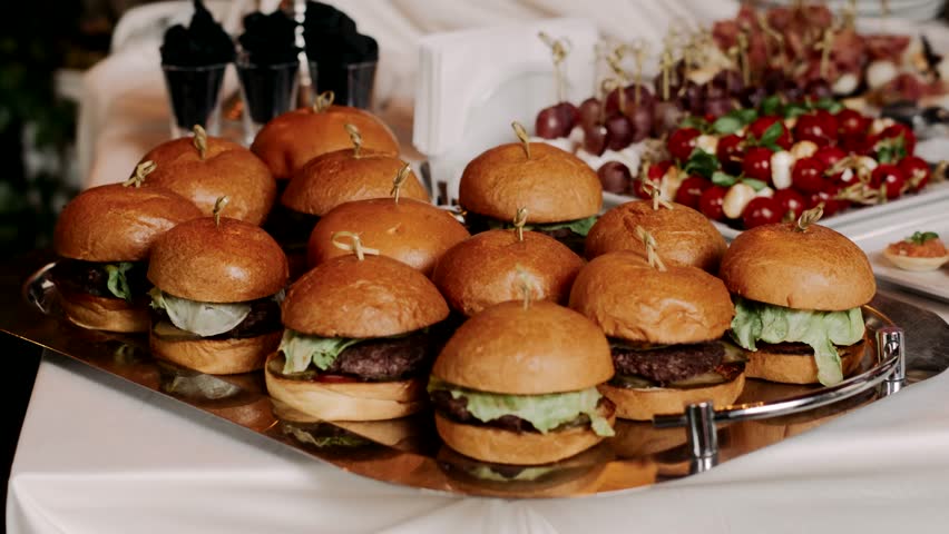 lots of burgers on a tray