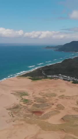 Vertical Drone Aerial Shot of Tottori Sand Dunes, Sea and Sculpted Sands at Japan