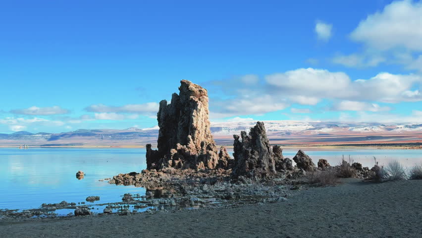 Panning of Mono Lake South Tufa prehistoric saline lake featuring South Tufa towers—intricate calcium-carbonate spires formed by freshwater springs bubbling into alkaline environment, California USA