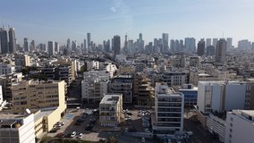 Lateral aerial drone footage of a coastal city skyline, capturing modern urban buildings along the waterfront. The scene shows a clear day and smooth cinematic movement. Ideal for travel, tourism, city promotion, and urban lifestyle projects. High-quality 4K video. - Powered by Shutterstock - Get 15% off with code: PIKWIZARD15