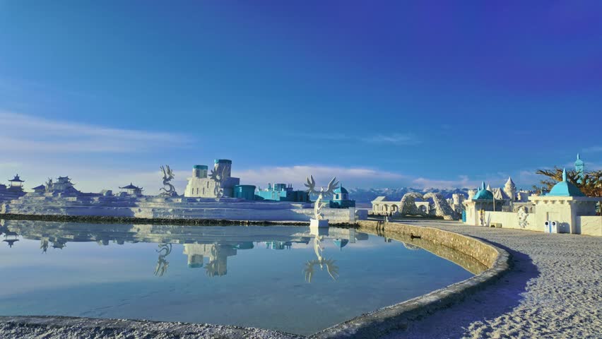 Chaka Salt Lake, Qinghai Province, China - A Surreal White-and-Blue Architectural Complex Stands Alone on a Vast Salt Desert Beneath a Clear, Deep Blue Sky - Pan Right Shot