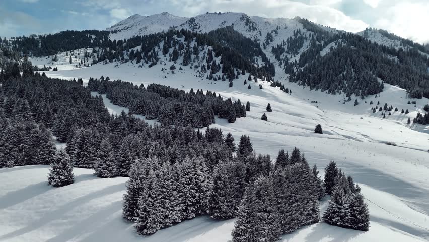 Aerial view of mountain valley with snow