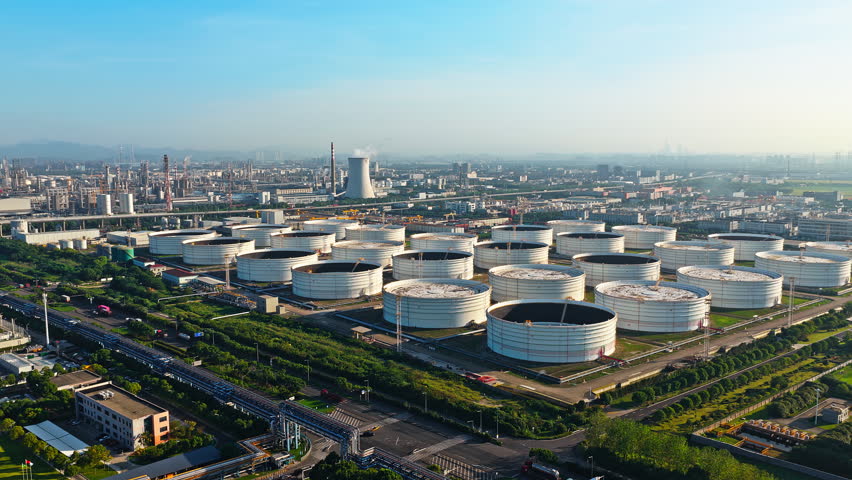 Aerial shot of oil storage tanks and chemical plant in large industrial area 