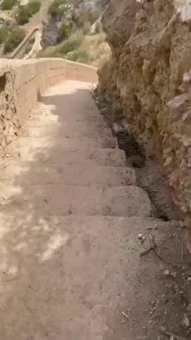 Long stairway leading down to a quiet hidden small beach