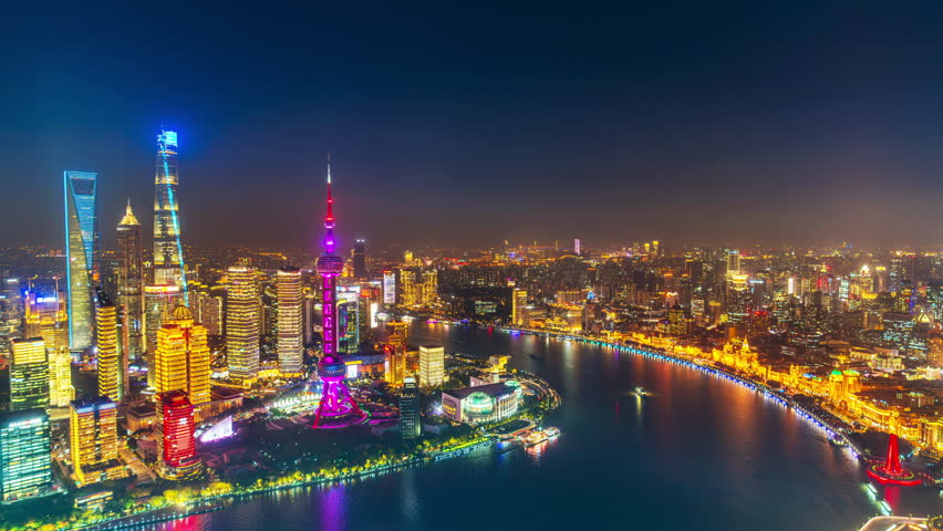 Aerial view of Shanghai city and Huangpu river at night, China.