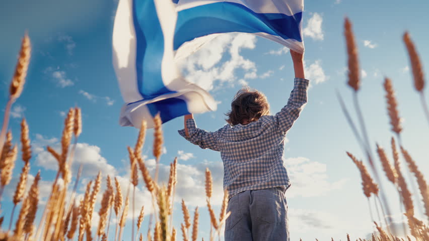 Happy israeli jewish little boys with Israel national flag. Independence Day. Patriotism. Patriot kids, friends on open area wheat field. Symbol of democracy, future.