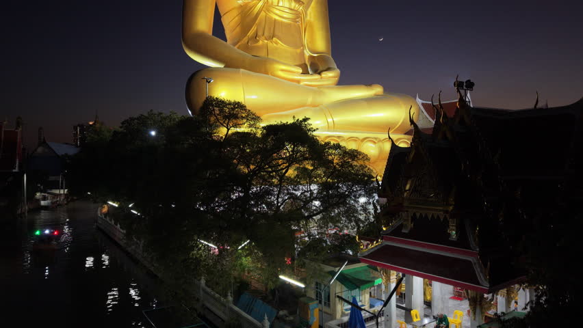 Bangkok, Thailand - 24th December 2025: Aerial View of Giant Buddha from Chao Phraya River at night