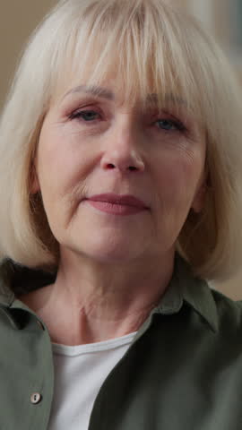 Close-up web cam view portrait angry Caucasian old woman talking looking at camera emotional furious mad negative senior female retired lady annoyed irritated grandmother talk arguing scolding at home