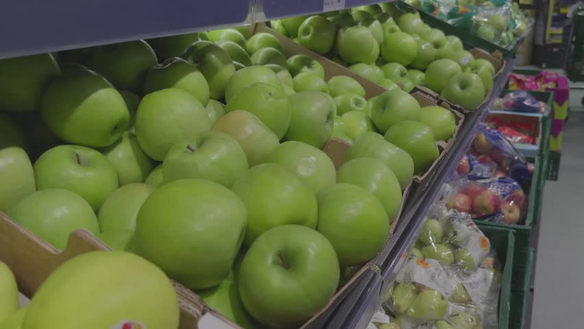 Pile of Fresh Green Granny Smith Apples in Store