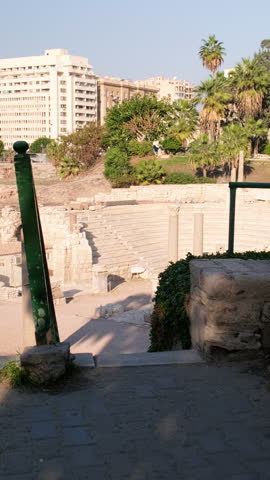 Ruins of roman amphitheatre in Alexandria, Egypt. Handheld real-time footage