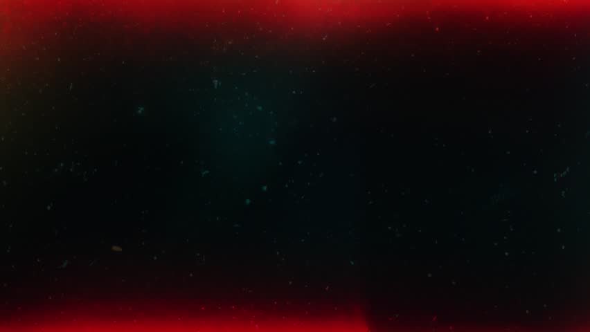 Red-black analog burn with scattered particles, grainy surface and faint film scratches, dusty retro texture with soft distortion and faded cinematic vibe