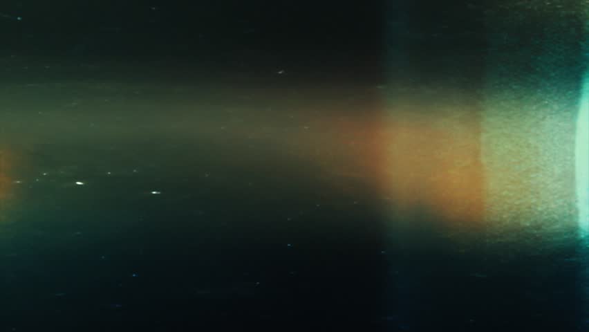 Bright teal and green light beam with reddish glow on edges, atmospheric lomo-style film texture with analog dust and subtle flicker, vertical motion and soft grain overlay