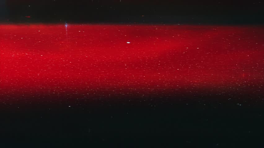 Vibrant red analog gradient with subtle film grain and dust particles, horizontal VHS-style distortion and glowing retro flicker, cinematic glitch overlay