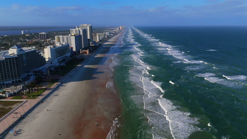 Wide aerial view of Daytona Beach Florida coastline with city skyline