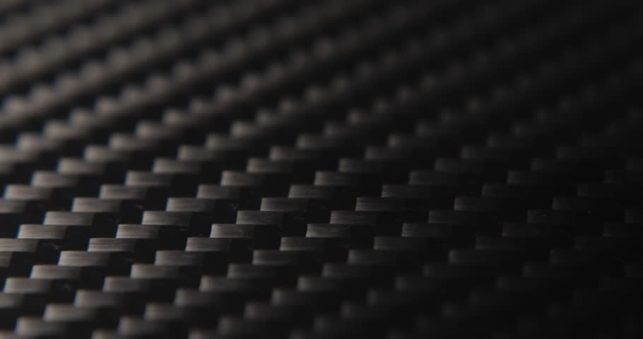 Close-up slide over the real carbon fiber texture background.