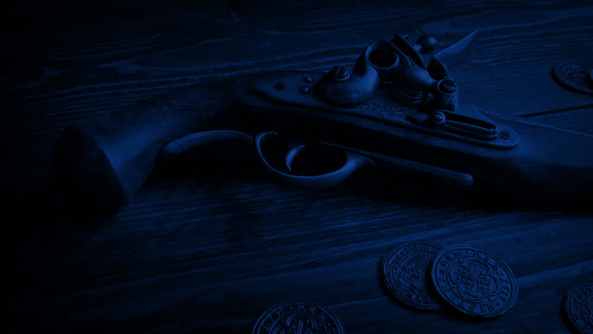 Pistol And Gold Coins On Table In The Dark
