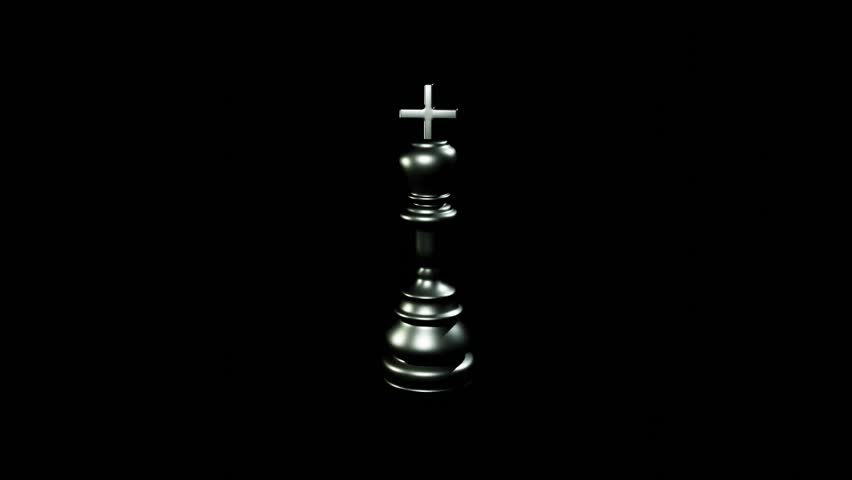 Silver chess king piece spinning continuously on black background with smooth motion