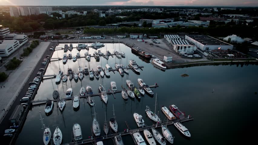 Boats docked in the harbor, Bordeaux, France. Panoramical view in the sunset, with drone movement