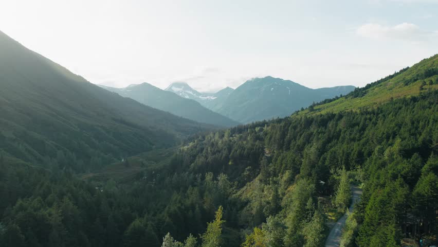 Slow aerial push in of a mountain range in Alaska.