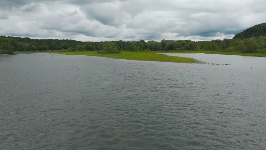 Flying Over Rippling Water Of Lake Eucha in Daytime In Tagg Flats, Oklahoma, USA. - aerial shot